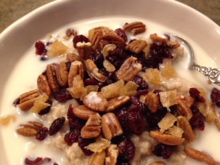 Oatmeal with Pecans, Dried Cranberries, Diced Candied Ginger, and Coconut-Almond Milk